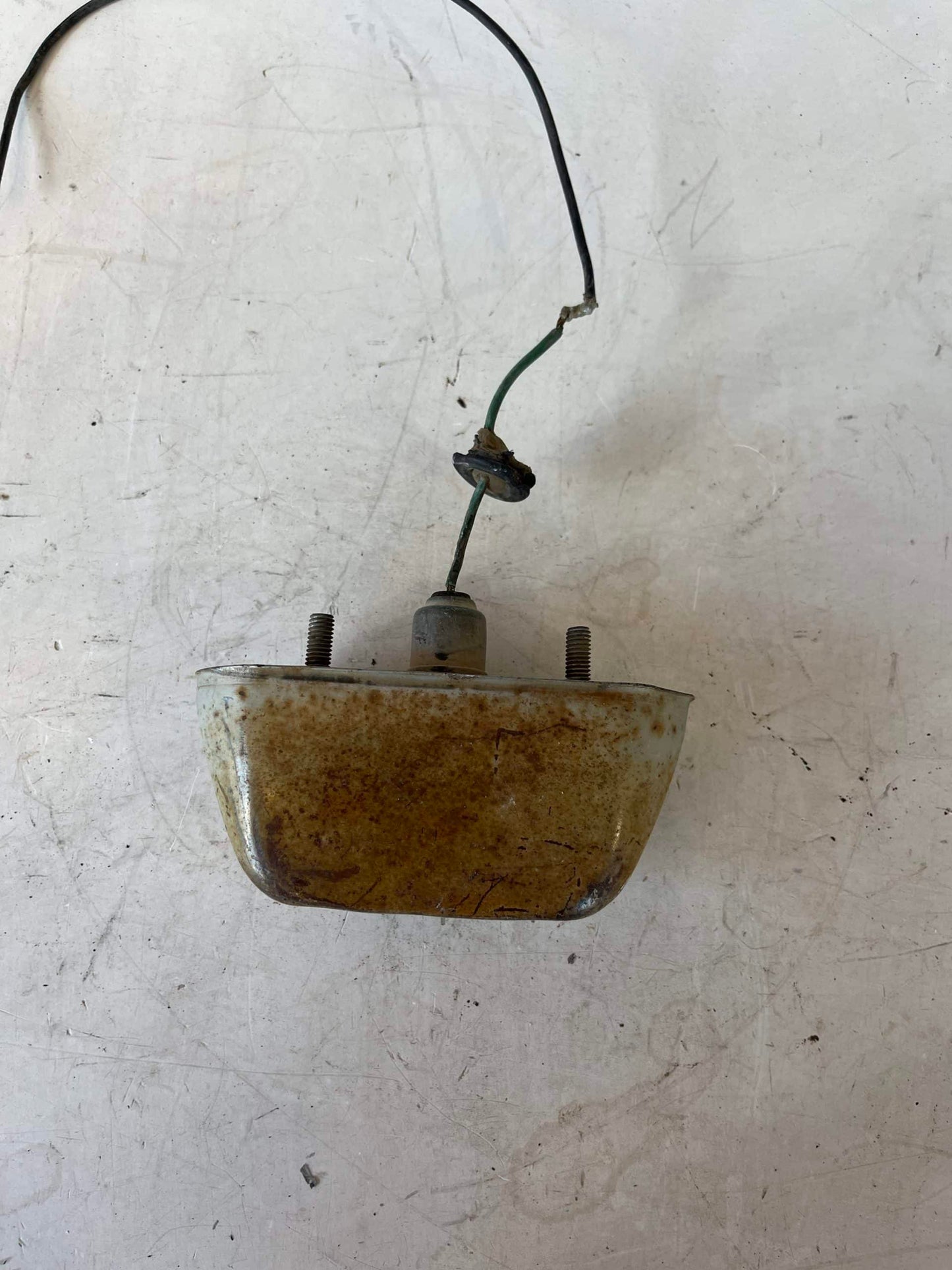 Used Early License Plate Light Assembly