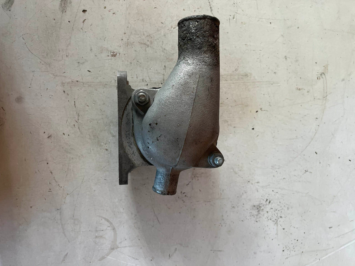 Used OEM FJ40 2F Thermostat Housing Assembly.
